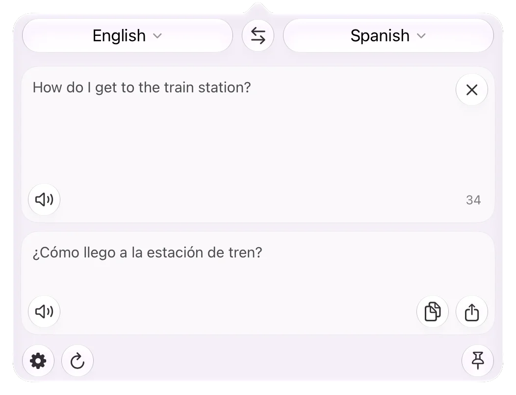 The popover hanging from the menu bar: English to Spanish, “How do I get to the train station?” translated as “¿Cómo llego a la estación de tren?”